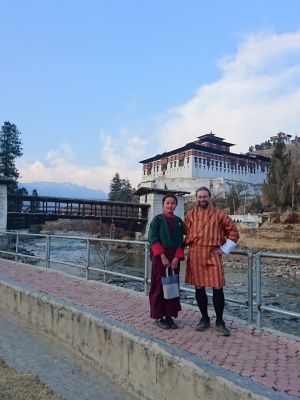 Bhutanese schoolgirl and foreigner in gho
