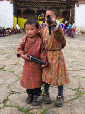 Kids playing with toy guns during Thangbi Mani