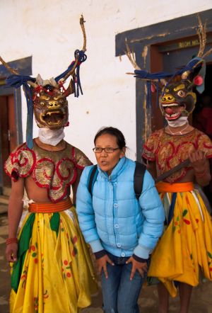 Tourist posing with dancers