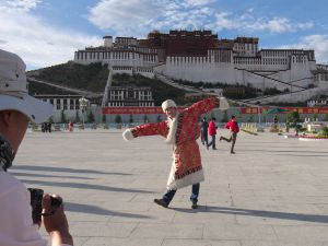 Tourist posing in Tibetan dress